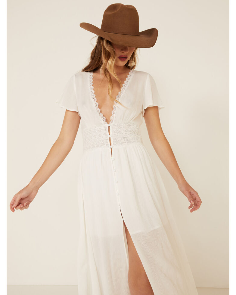 Cowboy hat and white lace button-up shirt