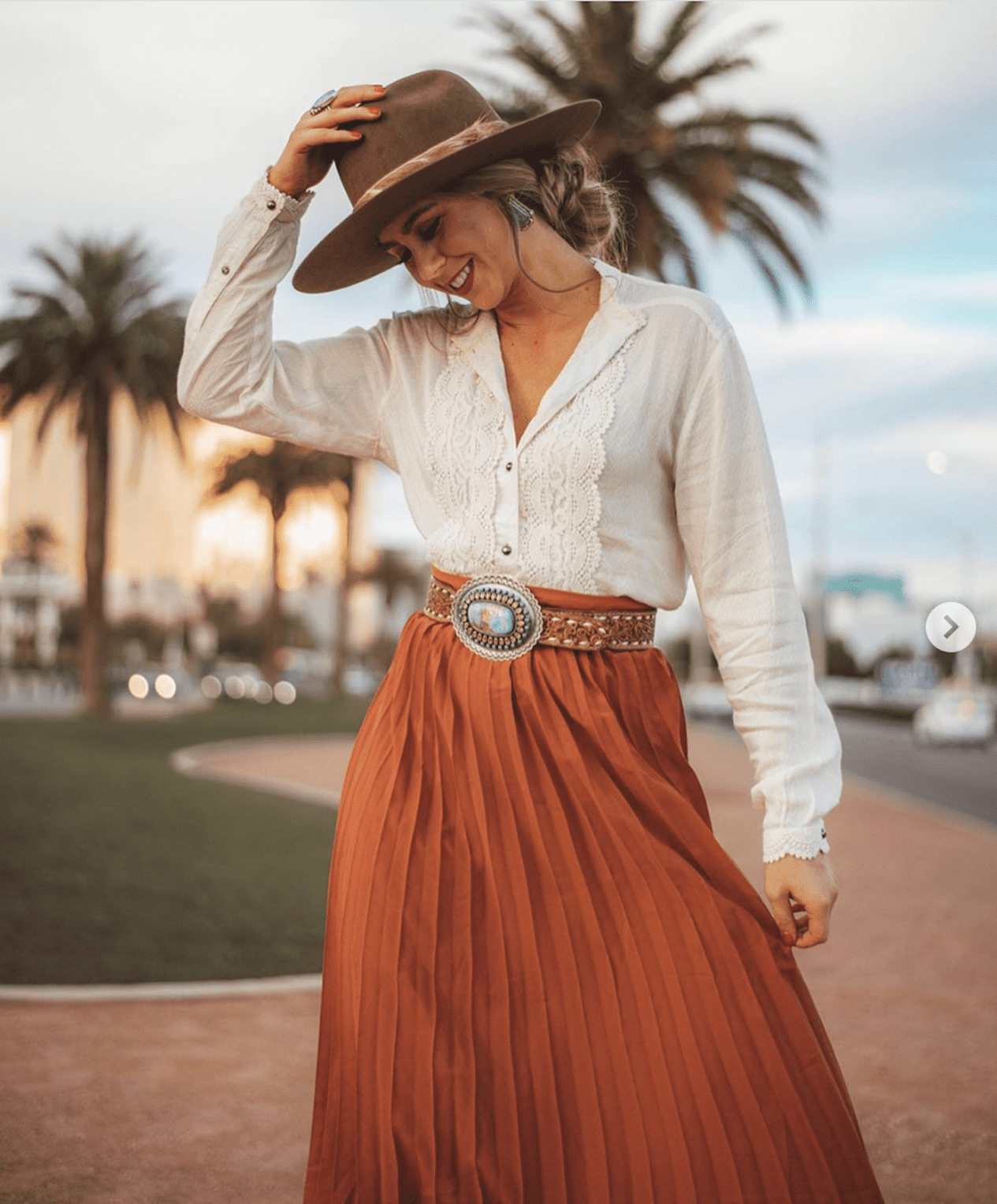 If you're wearing a cowboy hat with a skirt, pair it with a blouse and sandals.