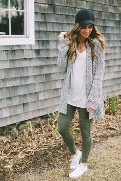 Wear a black cap with a grey sweater and leggings for a comfortable yet stylish look